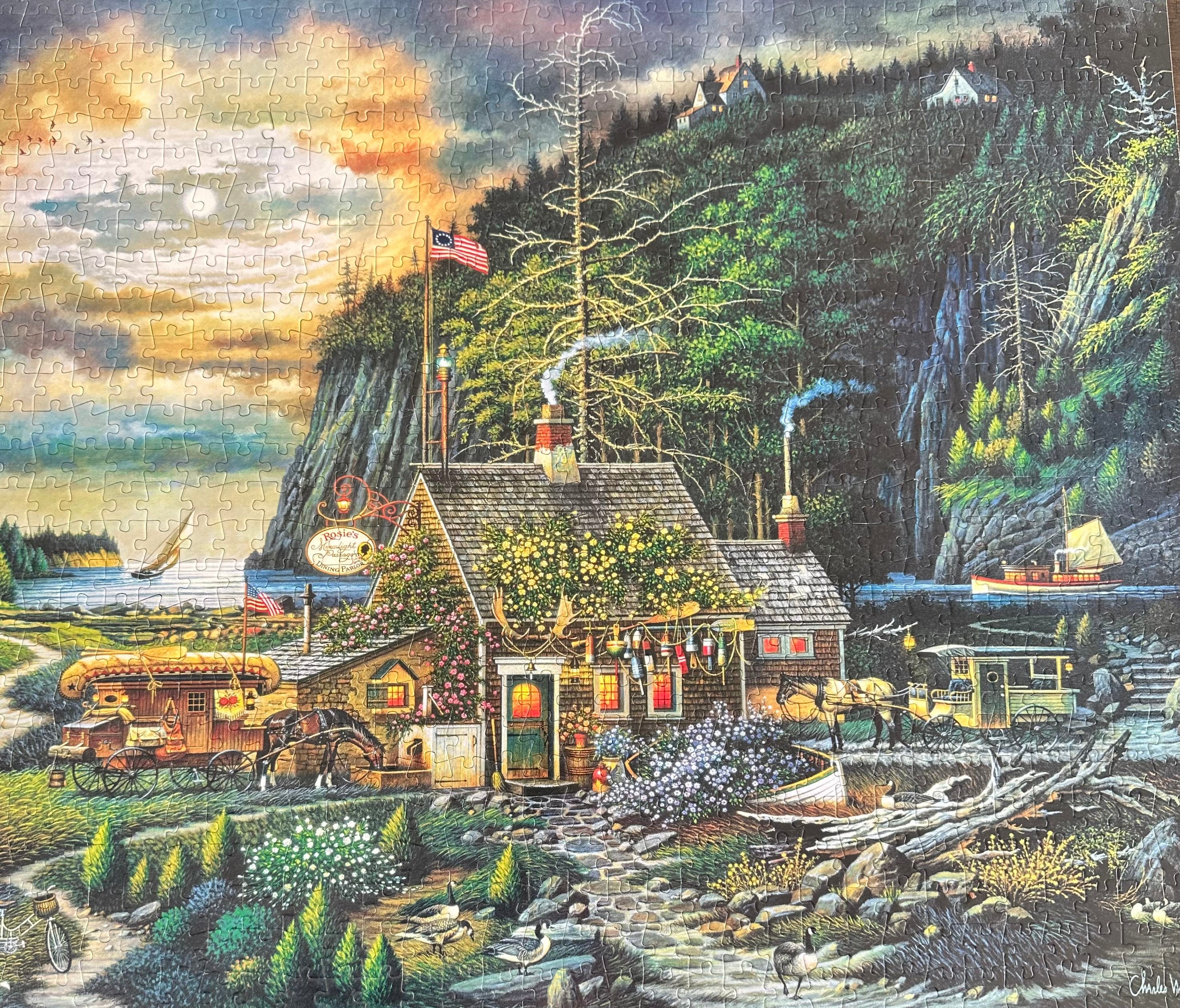 puzzle of a rustic cabin by a lake with a mountainous background